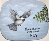 Chickadee In Flight
